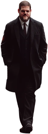 A man in a suit walking confidently through a city street at night, symbolizing professionalism and security.